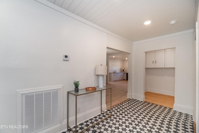 interior space with crown molding