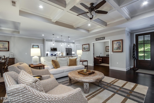 living room with beam ceiling, crown molding, coffered ceiling, and dark hardwood / wood-style flooring