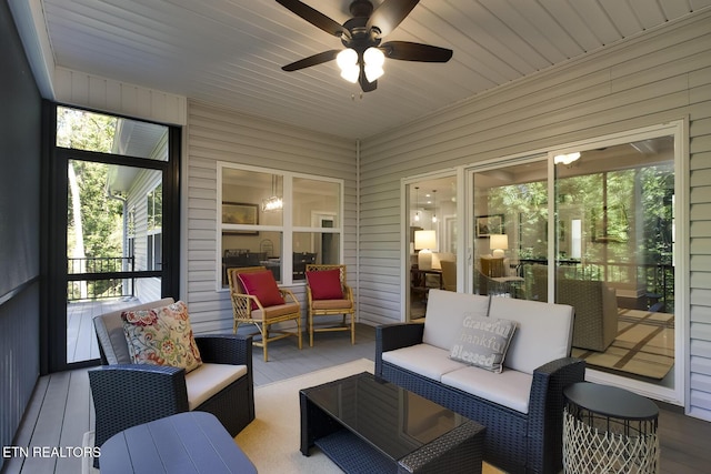 sunroom with wood ceiling and ceiling fan