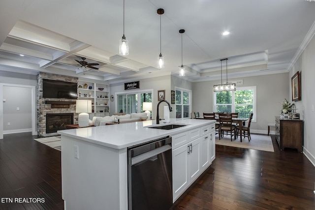 kitchen with sink, dishwasher, a kitchen island with sink, and white cabinets