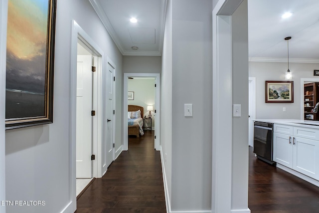 corridor featuring ornamental molding, dark hardwood / wood-style flooring, and sink