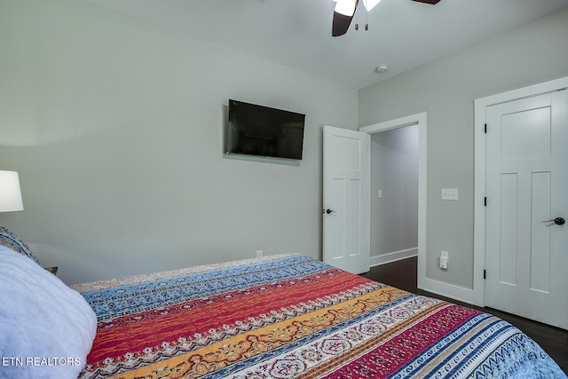 bedroom featuring dark hardwood / wood-style floors and ceiling fan