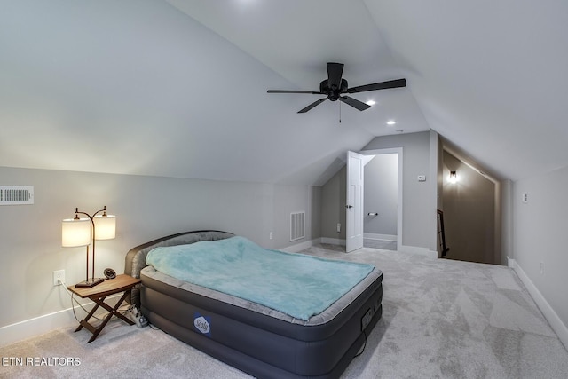 carpeted bedroom featuring lofted ceiling