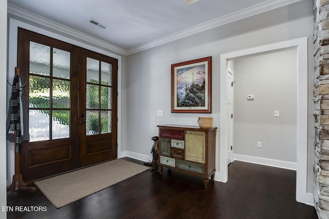 foyer entrance featuring french doors, dark hardwood / wood-style floors, and crown molding