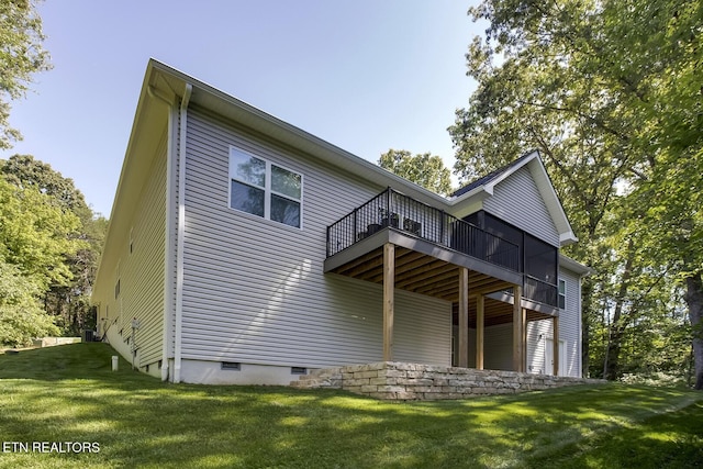 rear view of house with a lawn