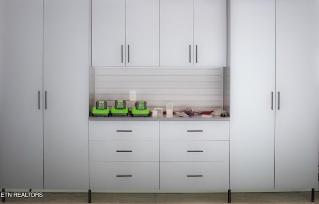 bar with white cabinetry