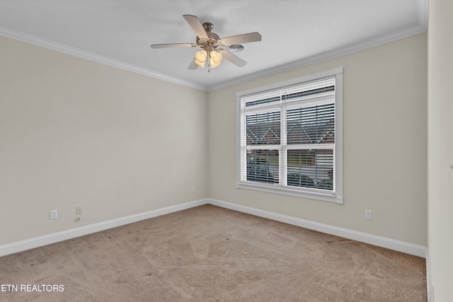 spare room with crown molding, light colored carpet, and ceiling fan