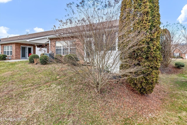 rear view of property featuring a yard