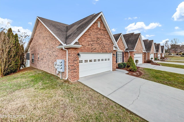 view of front of home featuring a garage and a front yard