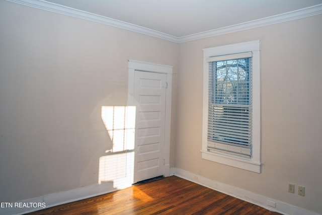 unfurnished room with crown molding and dark hardwood / wood-style flooring