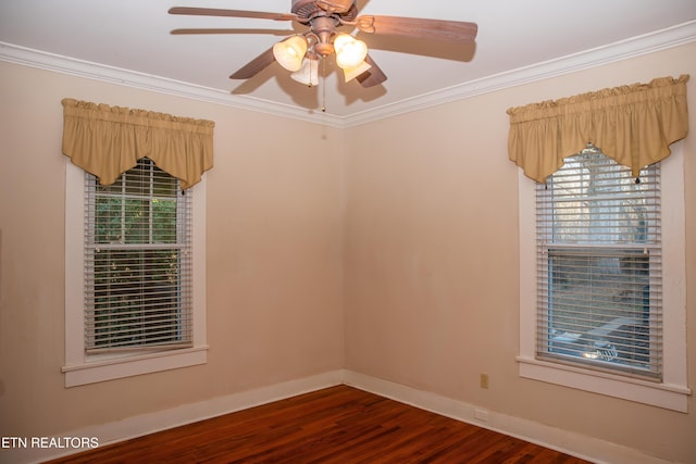 empty room featuring crown molding, ceiling fan, dark hardwood / wood-style flooring, and a wealth of natural light