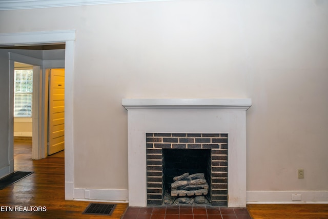 interior details featuring hardwood / wood-style floors and a fireplace