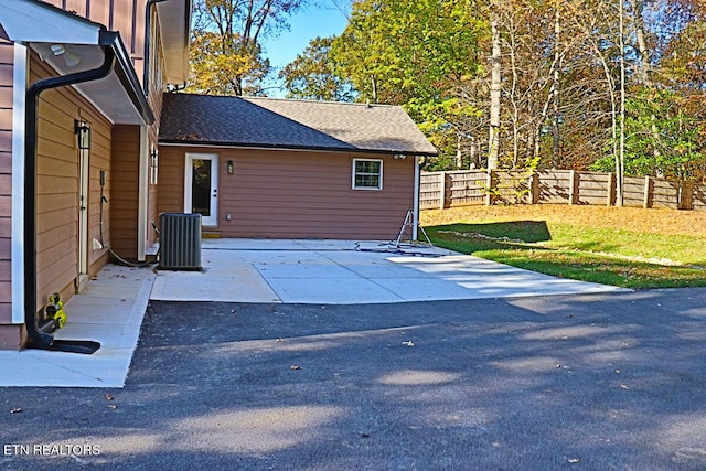 view of patio / terrace featuring central AC unit and a fenced backyard