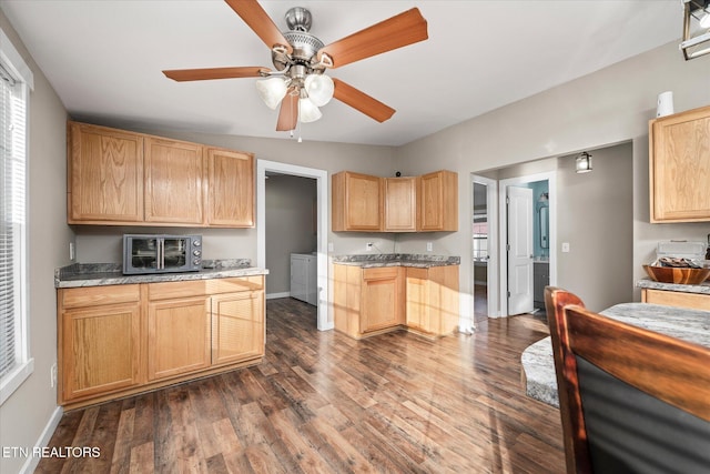 kitchen featuring ceiling fan, light brown cabinets, and dark hardwood / wood-style flooring