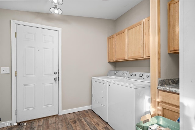 laundry room with separate washer and dryer, dark wood-type flooring, and cabinets