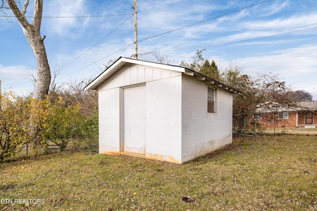 view of outdoor structure with a lawn