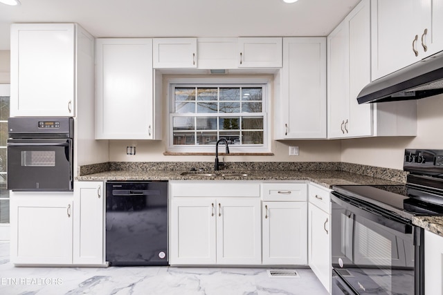 kitchen with white cabinetry, sink, black appliances, and dark stone counters