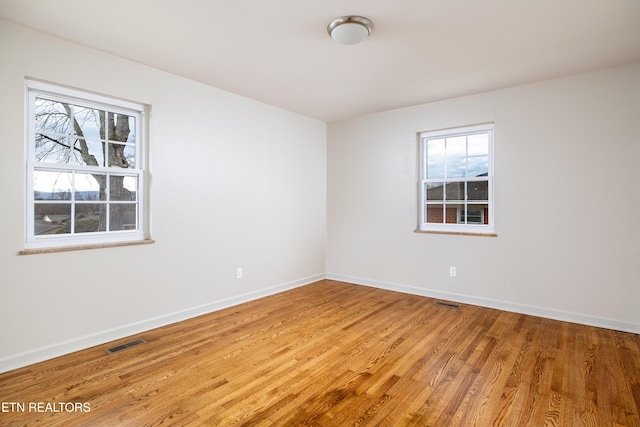 unfurnished room featuring wood-type flooring