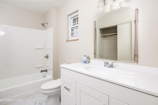 full bathroom featuring bathing tub / shower combination, vanity, and toilet