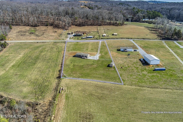 birds eye view of property featuring a rural view