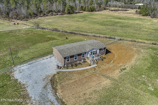 birds eye view of property with a rural view