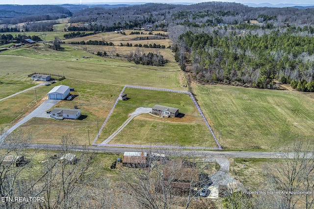 birds eye view of property featuring a rural view