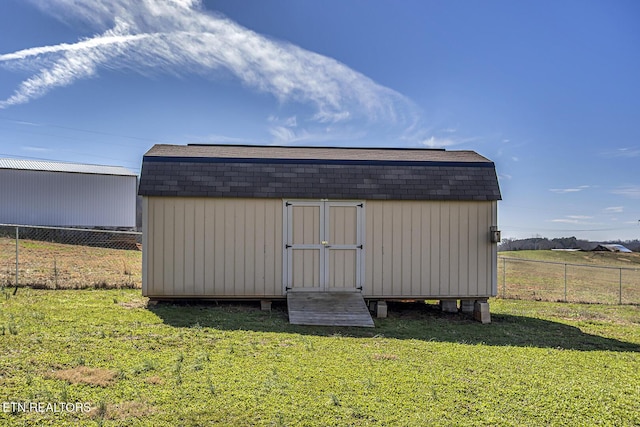 view of outdoor structure with a lawn