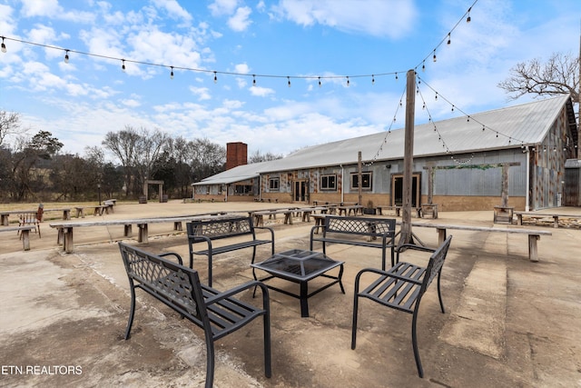 view of patio with an outdoor fire pit