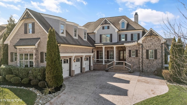 view of front of home featuring a garage and covered porch