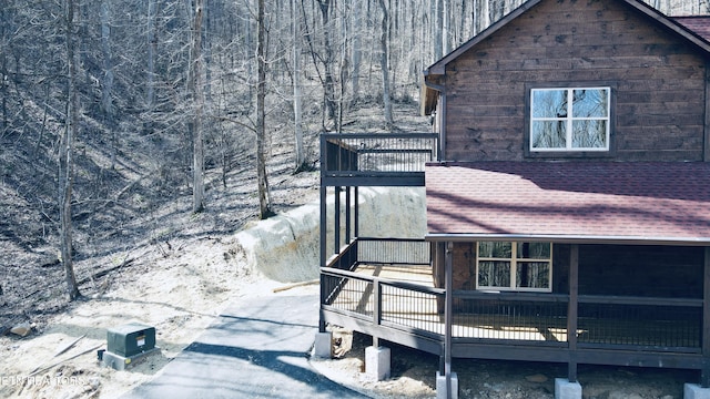 view of home's exterior featuring a wooden deck