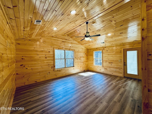 bonus room featuring lofted ceiling, wood ceiling, ceiling fan, dark hardwood / wood-style floors, and wood walls