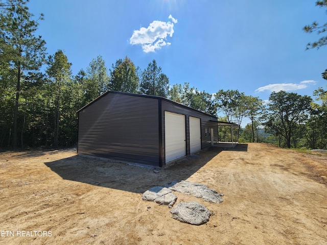 view of outbuilding with a garage