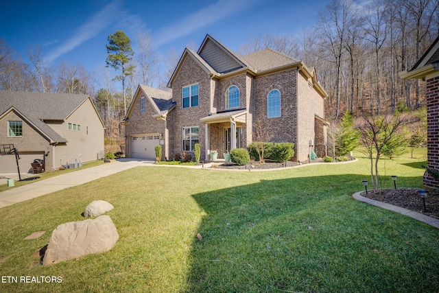 view of front of home featuring a garage and a front yard