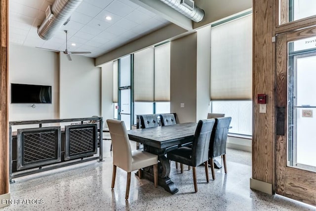 dining space with a wealth of natural light and ceiling fan