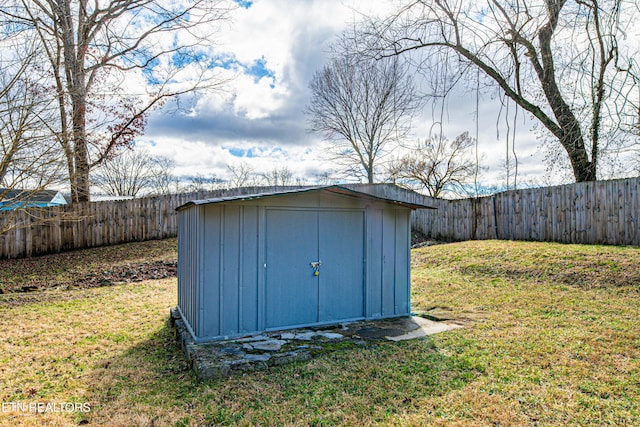 view of outdoor structure with a lawn