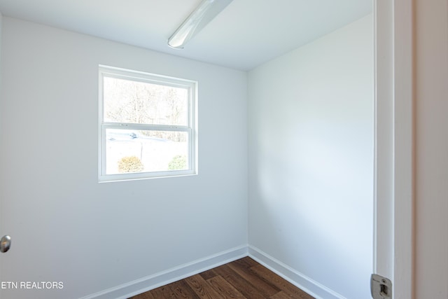 spare room featuring dark hardwood / wood-style floors