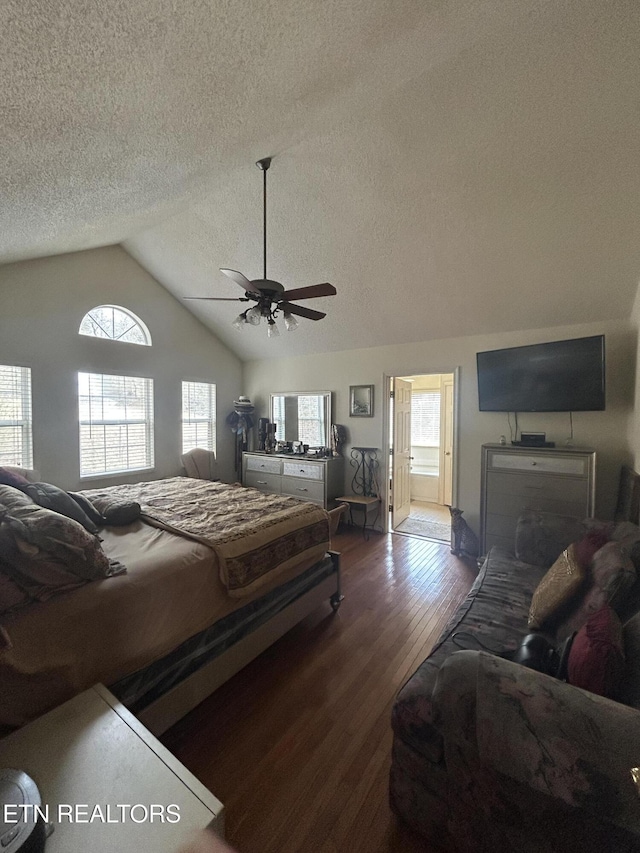 bedroom featuring wood-type flooring, lofted ceiling, a textured ceiling, and ceiling fan