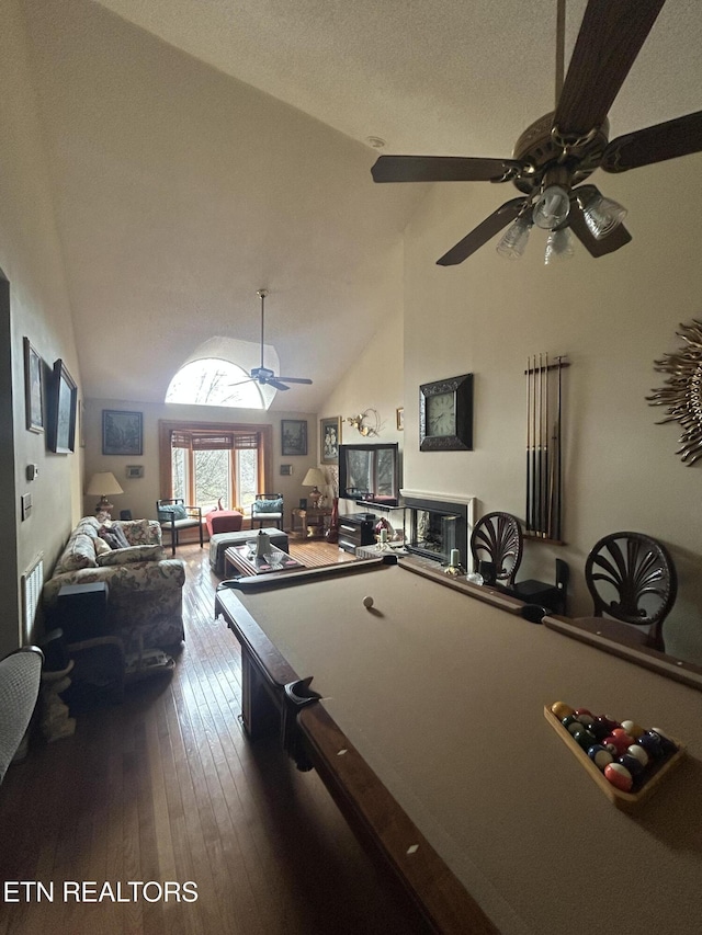 rec room with ceiling fan, pool table, high vaulted ceiling, and hardwood / wood-style flooring