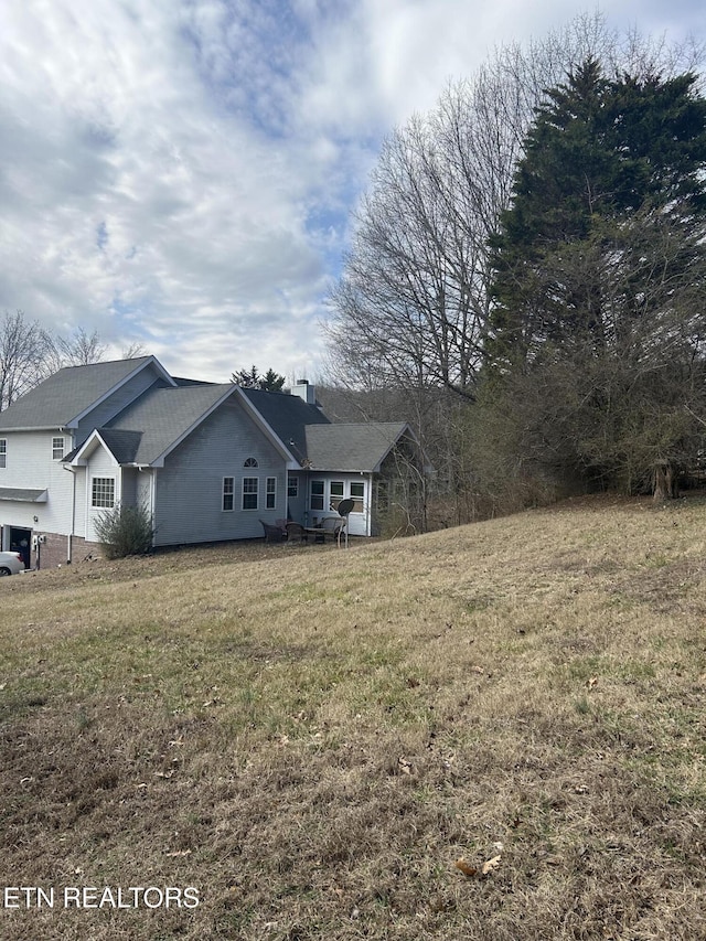 exterior space featuring a lawn