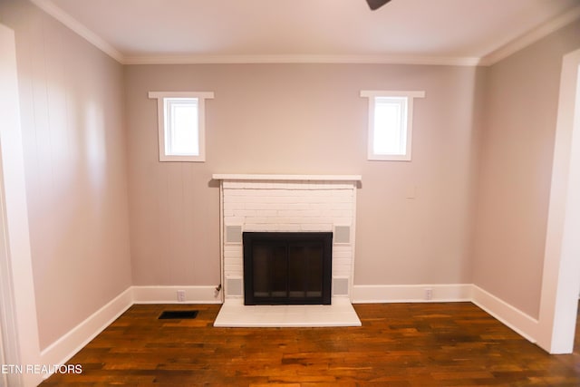 unfurnished living room with dark hardwood / wood-style flooring, crown molding, and a fireplace