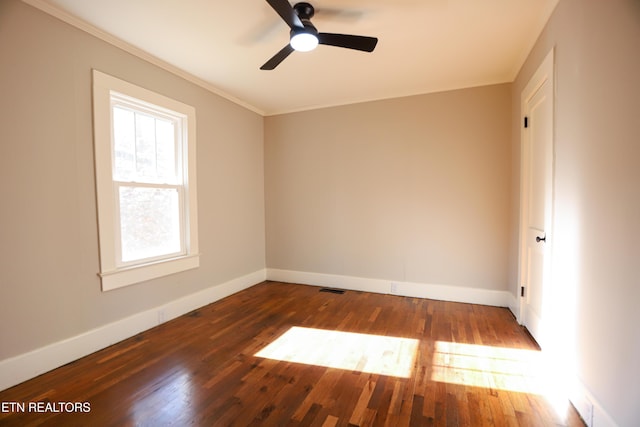 spare room featuring ornamental molding, dark hardwood / wood-style floors, and ceiling fan