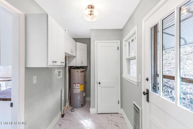 interior space featuring heating unit and water heater