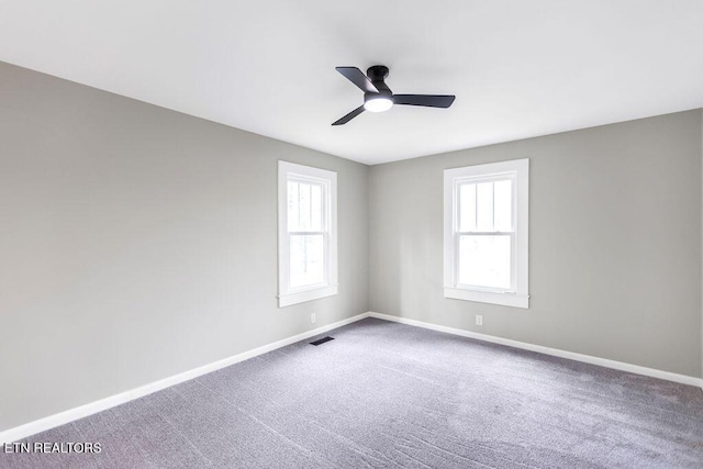 carpeted empty room with ceiling fan