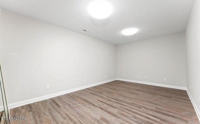 295 Caulderwood Ln, Lenoir City, TN 37771 - empty room featuring wood finished floors, baseboards, and visible vents