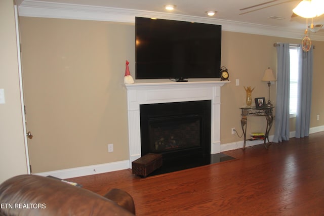 living room with crown molding, ceiling fan, and wood-type flooring