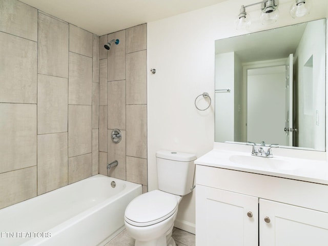 full bathroom featuring tiled shower / bath, vanity, and toilet