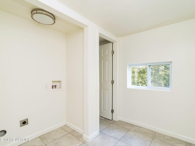 washroom featuring hookup for a washing machine, light tile patterned flooring, and electric dryer hookup