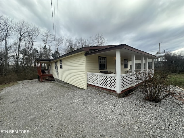 view of property exterior with a porch