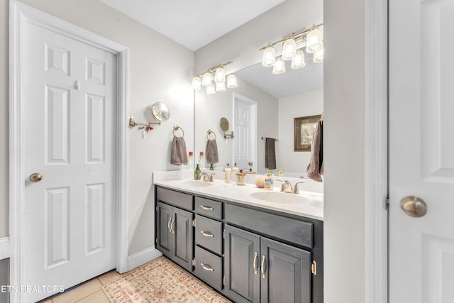 bathroom with tile patterned flooring and vanity