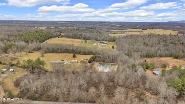 birds eye view of property featuring a water view and a rural view